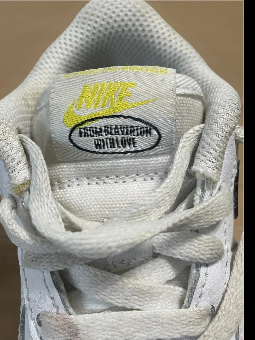 Nike Toddler White Sneakers with Black Swoosh and Yellow Star